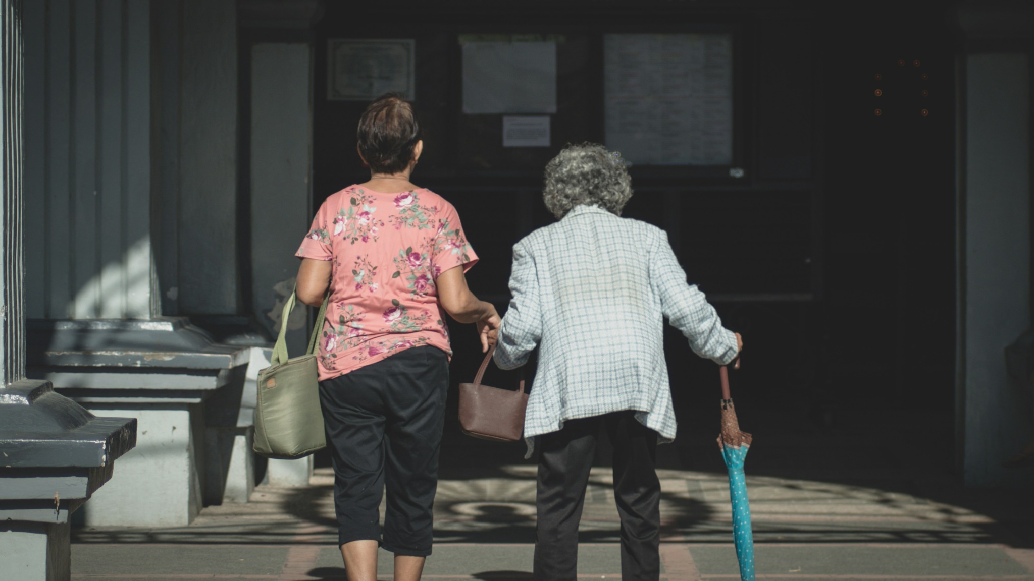 Caregiver walking with an older adult